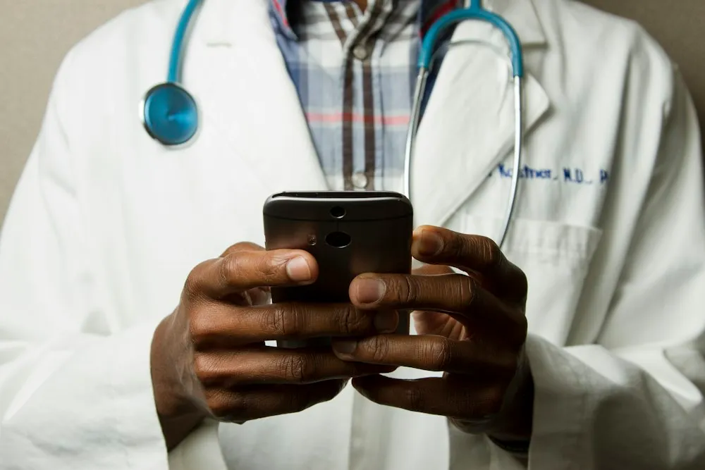Doctor checking a phone